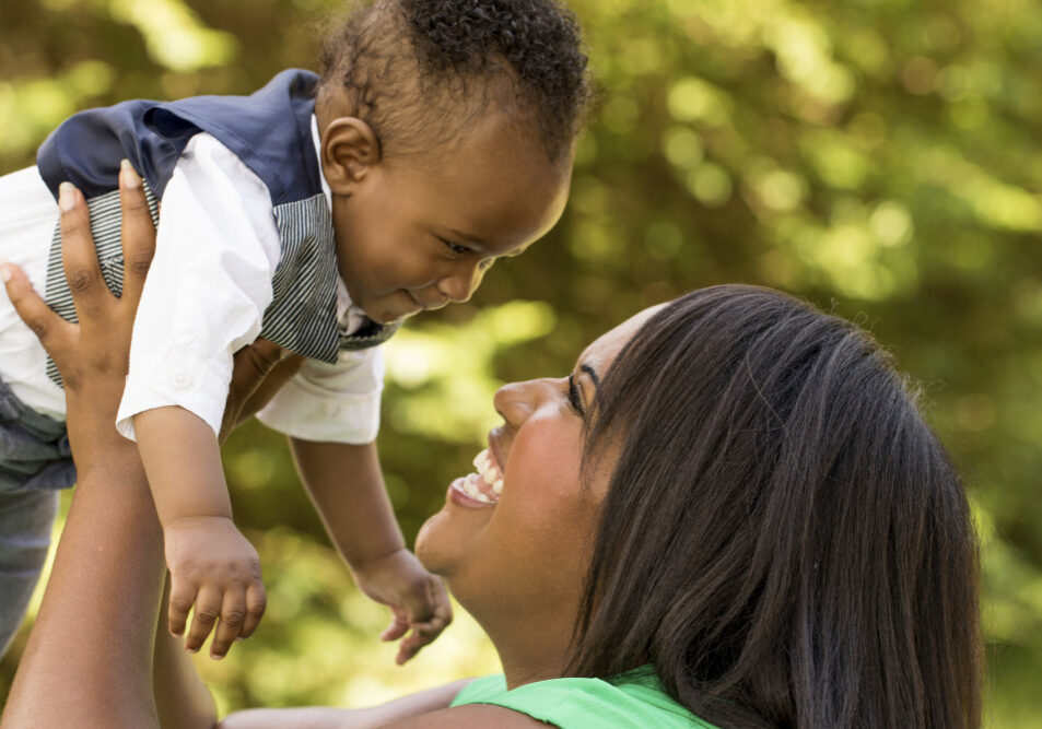 African American mother holding her baby.